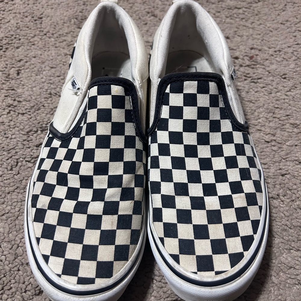 Black and white checkered slip on vans
